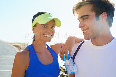 Buy stock photo Couple, outdoor and runners with water, workout and fitness with smile, training and sunrise for run. Man, woman and athletic on road, young and exercise together in summer, morning and happy