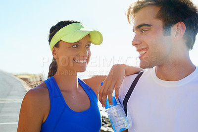 Buy stock photo Couple, outdoor and athlete with water, workout and fitness with smile, training and sunrise for run. Man, woman and athletic on road, young and exercise together in summer, morning and happy