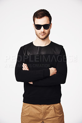 Buy stock photo Portrait of a confident and trendy man standing with his arms folded