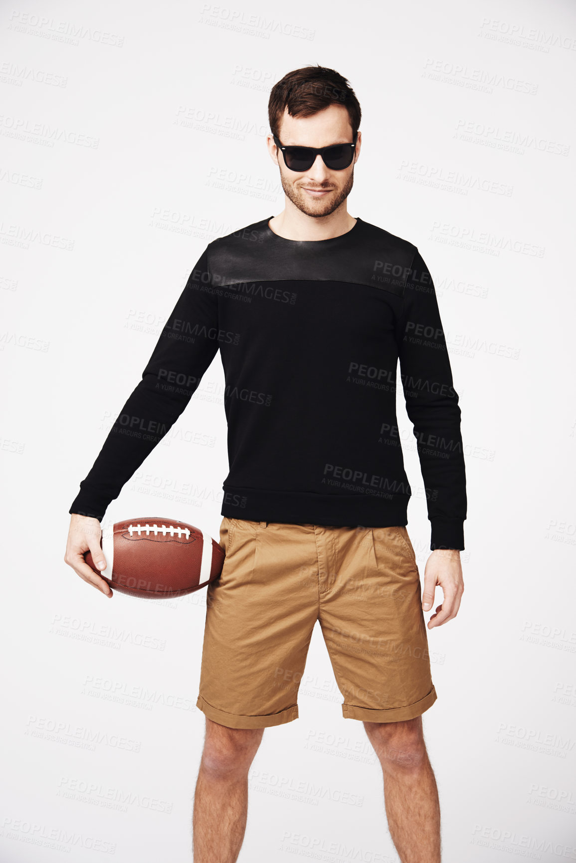 Buy stock photo Sunglasses, fashion and man in studio with football for confident, pride and stylish clothing. Fitness, sport and portrait of male person with ball in funky, cool and trendy style on white background