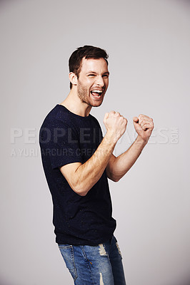 Buy stock photo Winner, celebration and man cheer with success in studio for good news, winning and achievement. Celebrate, happy and excited male person on white background for victory, announcement and cheering