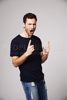 Buy stock photo Winner, excited and man with celebration for success in studio for good news, winning and achievement. Celebrate, happy and male person on gray background for victory, announcement and cheering
