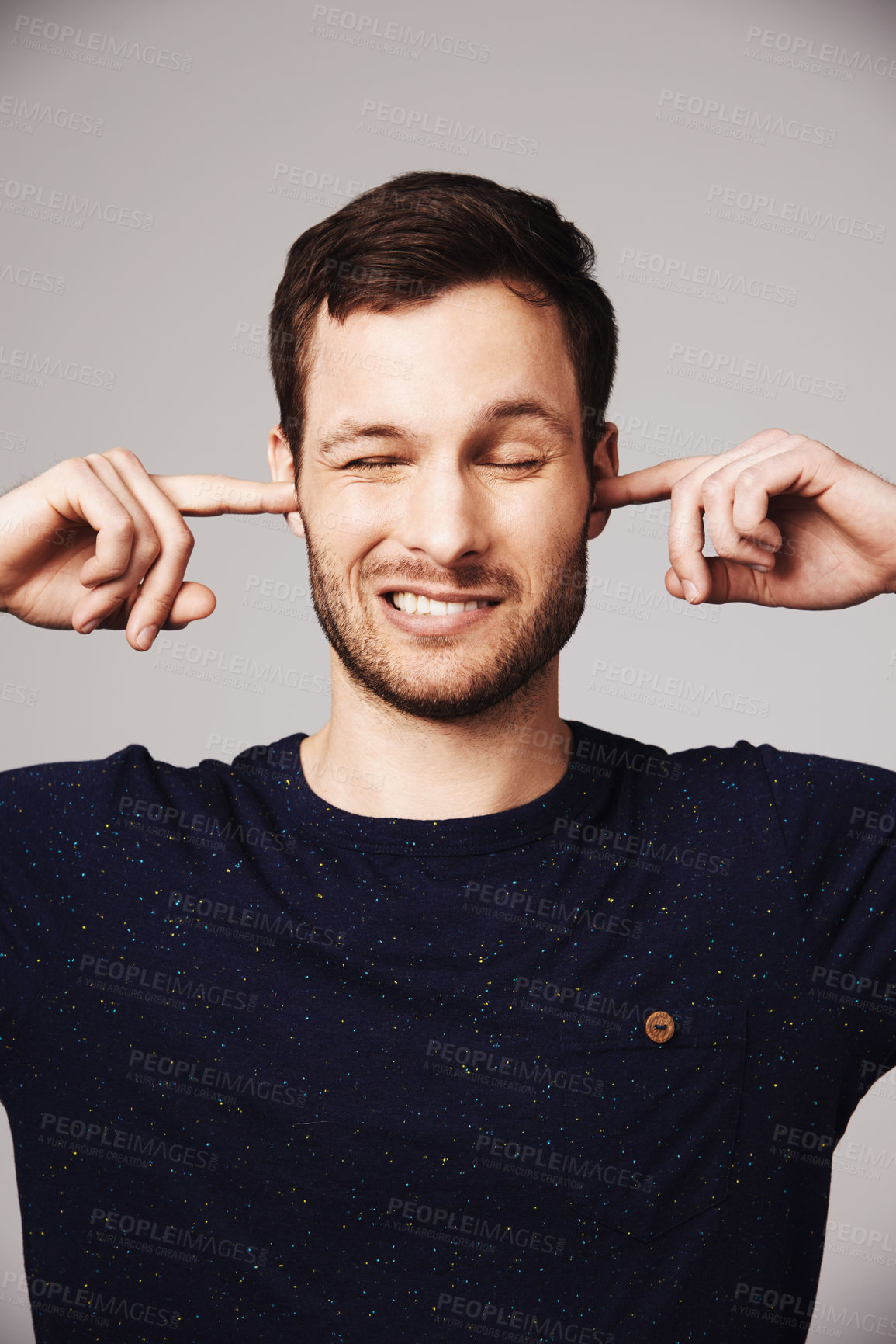 Buy stock photo Block sound, man and finger in ears of a person loud music problem in a studio. Frustrated, isolated and grey background of a male model pain with closed ear from noise for silence and peace