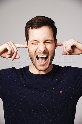 Buy stock photo Man, scream and block ears in studio with anger, frustrated face and mental health problem by white background. Isolated guy, model and angry shout with stress, anxiety or noise by gray backdrop