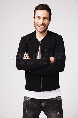 Buy stock photo Portrait, happy man and arms crossed in white background, casual style and confident attitude. Handsome young male model, laughing guy and smile in studio for good mood, happiness and fashion clothes