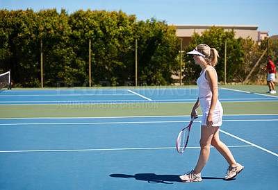 Buy stock photo A young female tennis player out on the court