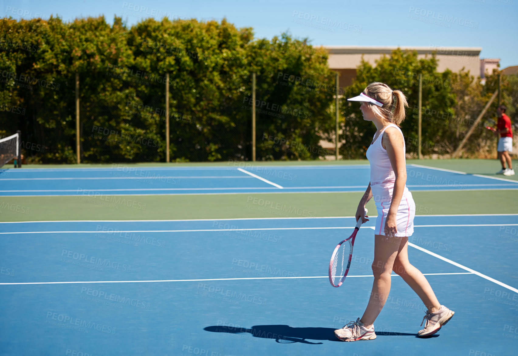 Buy stock photo A young female tennis player out on the court