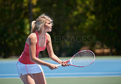 Buy stock photo A tennis player with her tennis racket on a tennis court