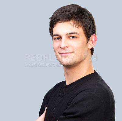 Buy stock photo Portrait, smile and confident young man in studio on gray background with space for casual fashion. Face, happy and friendly with natural model on mockup in relaxed tshirt or clothes outfit for style