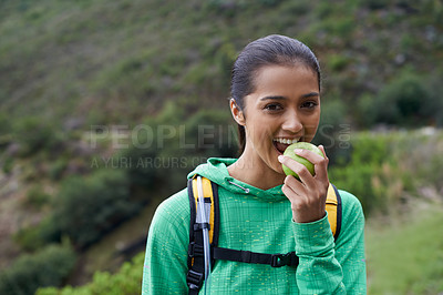 Buy stock photo Eating, fruit and hiking portrait of woman in park, nature or apple in backpack for energy. Happy, trekking and hungry person relax outdoor on trail with healthy food for wellness on adventure