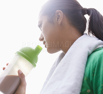 Buy stock photo Sports, drink and woman with protein shake in bottle for health, wellness and energy benefits after exercise. Outdoor, fitness or person with smoothie in container for nutrition in diet after workout