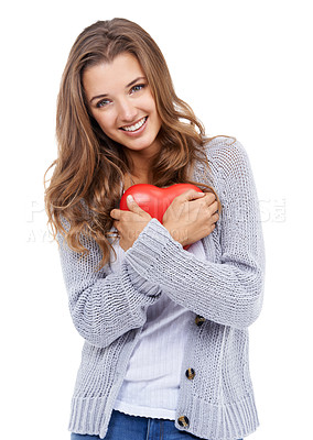 Buy stock photo Studio shot of an attractive young woman holding a small heart isolated on white