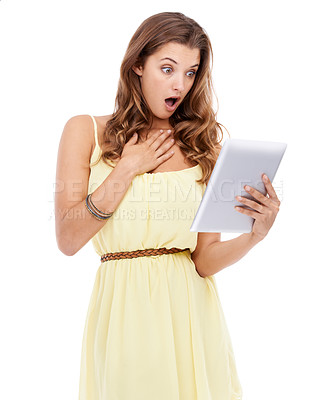 Buy stock photo Studio shot of a surprised looking young woman holding a digital tablet