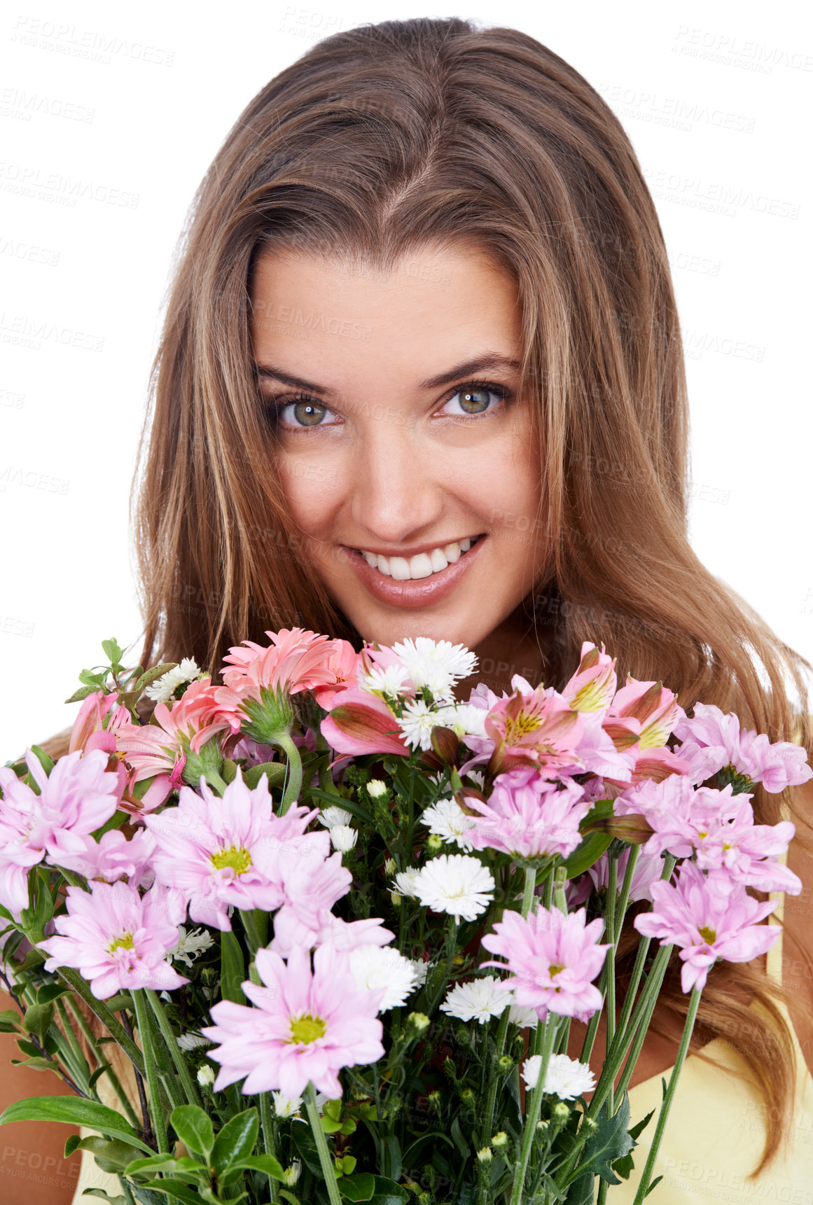 Buy stock photo Studio shot of an attractive woman holding a bouquet of flowers