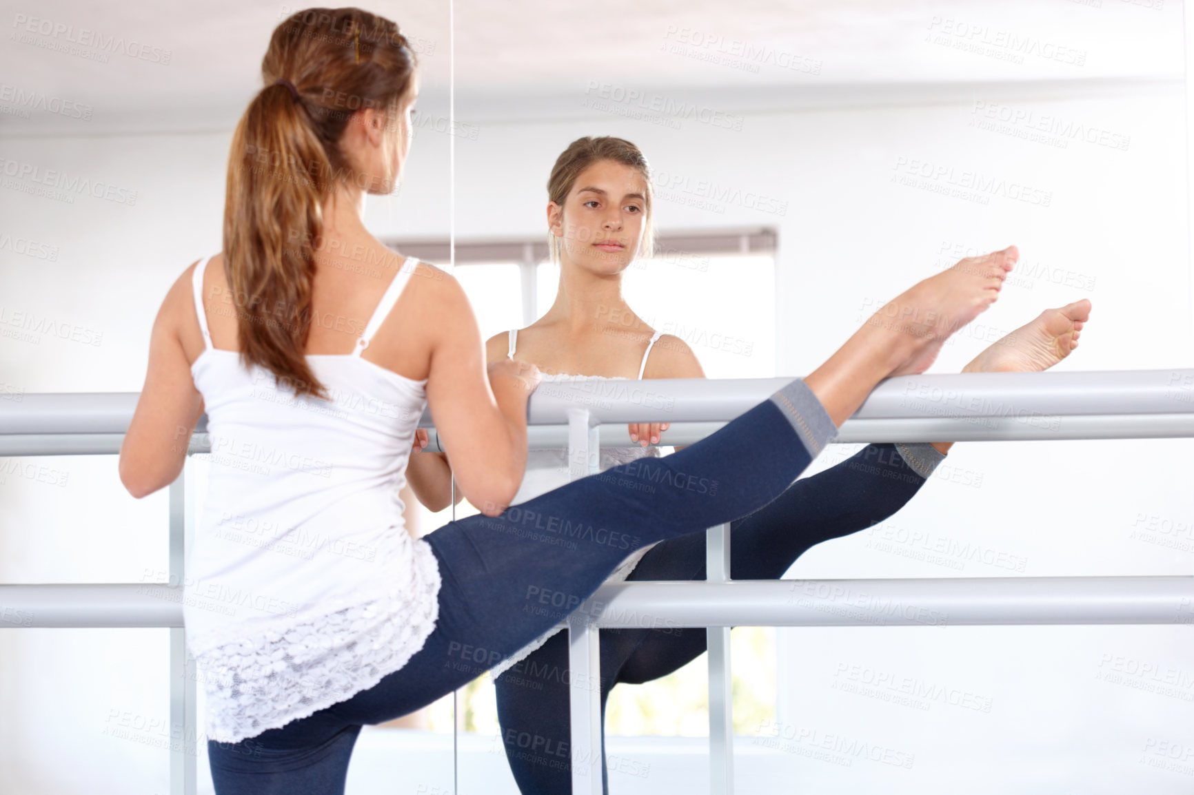 Buy stock photo Stretching legs, ballet and girl on mirror in studio, barre and student exercise. Ballerina, young teenager and reflection for flexibility training, dance choreography for performance art and fitness
