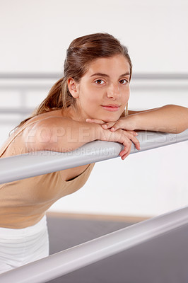 Buy stock photo Portrait, ballerina and girl on barre in studio, practice and student exercise in academy. Ballet, young teenager and training, dance choreography for art or performance for body fitness at school