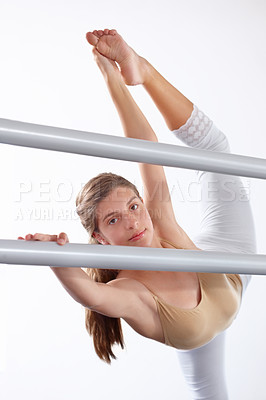 Buy stock photo Portrait, ballet and girl stretching legs on barre in classroom,  practice and student exercise. Ballerina, flexibility and warm up for training, dance choreography for art or performance for fitness