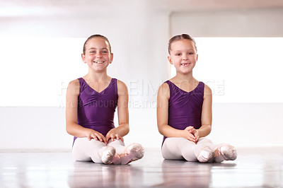 Buy stock photo Ballet, class and happy portrait of kids on floor in studio at start of education, training and stretching legs. Dance, students and sitting on ground at academy school for performance rehearsal