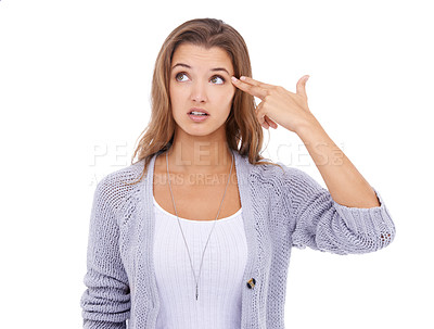 Buy stock photo Face, bored and woman with hand gun in studio for self harm, gesture or pressure crisis on white background. Finger, weapon and female model with overthinking mistake, disaster and suicide awareness