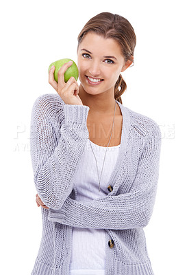 Buy stock photo A gorgeous young brunette holding an apple while isolated on a white background