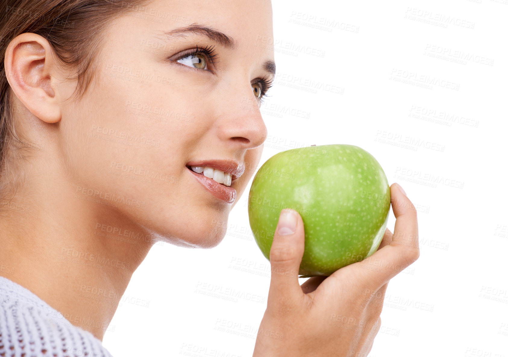 Buy stock photo Woman, eating and apple in hand, nutrition and health with snack, diet for weight loss and detox on white background. Healthy food, wellness and green fruit, vegan and organic with smile in studio