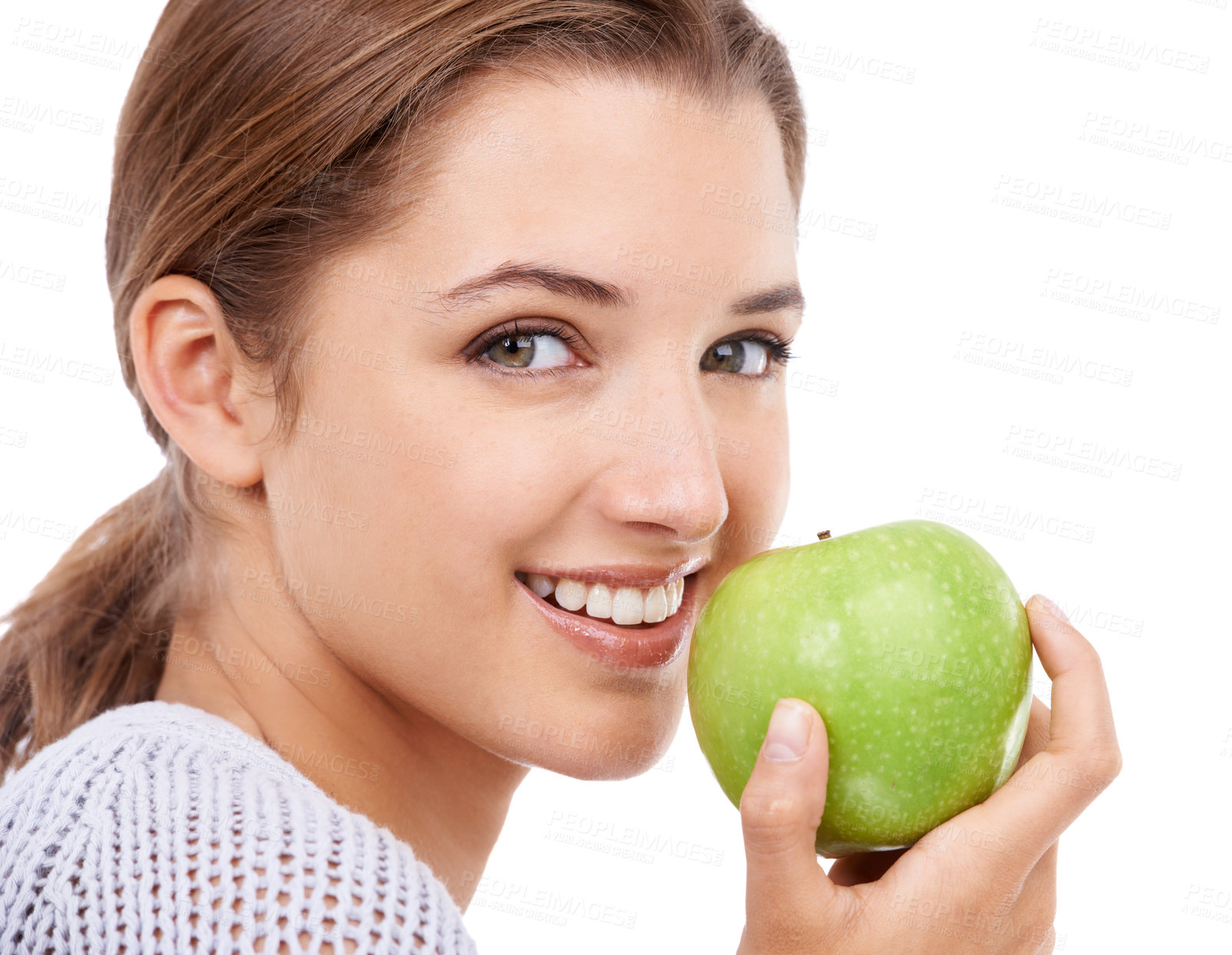 Buy stock photo Woman, portrait and eating apple, nutrition and gut health with snack or meal, diet for weight loss on white background. Healthy food, wellness and fruit, vegan and organic with smile in studio