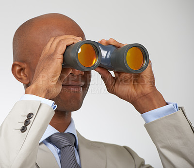 Buy stock photo Businessman, searching and career opportunity with binoculars in studio for job, professional or white background. Male person, smile and employment future growth or mockup space, search or corporate