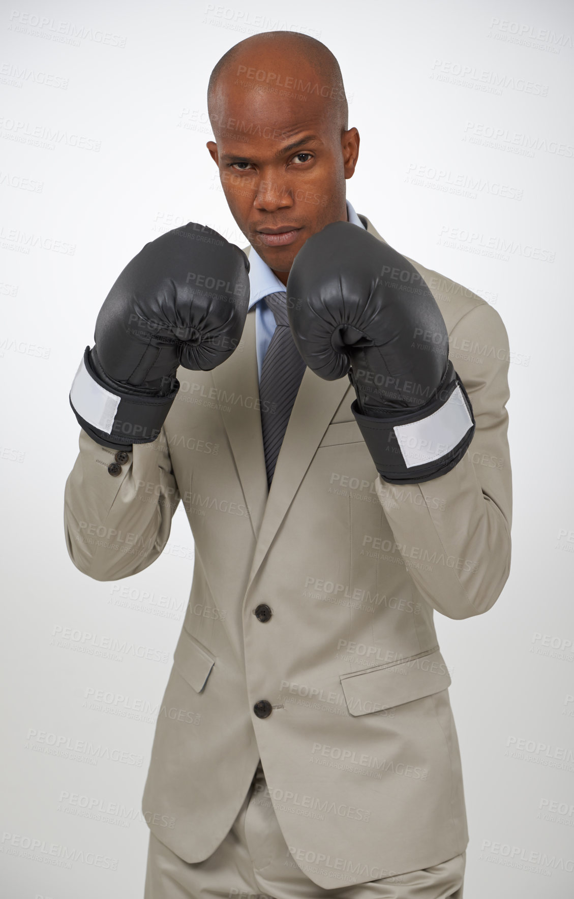Buy stock photo Boxing gloves, studio portrait and professional black man, fighter or lawyer to fight for government law. Battle, boxer and African agent for legal defence, protection or security on white background