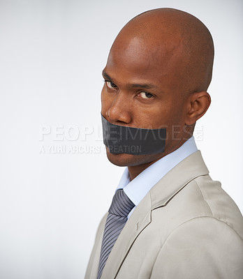 Buy stock photo Businessman, portrait and tape on mouth silence or corporate censored for secret, blackmail or quiet. Black person, face and journalist in company career trouble or white background, studio or mockup