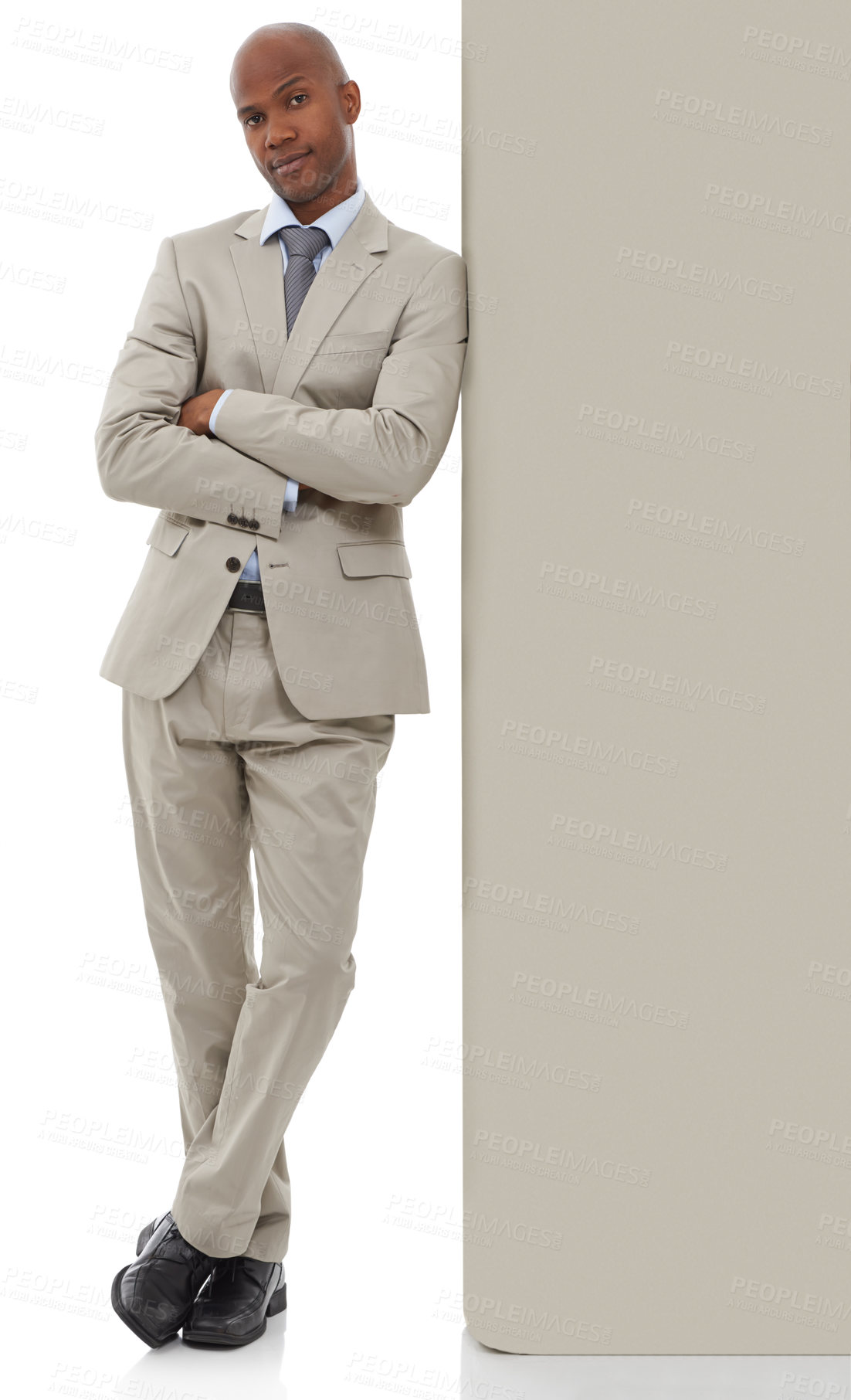Buy stock photo Businessman, portrait and leaning on wall in confidence with arms crossed on a white studio background. Young black man, African employee or professional in business fashion or suit on mockup space