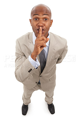 Buy stock photo Portrait, business man and secret on lips in studio for surprise, privacy or confidential news on white background from above. African worker, whisper emoji or quiet sign for mystery, gossip or noise