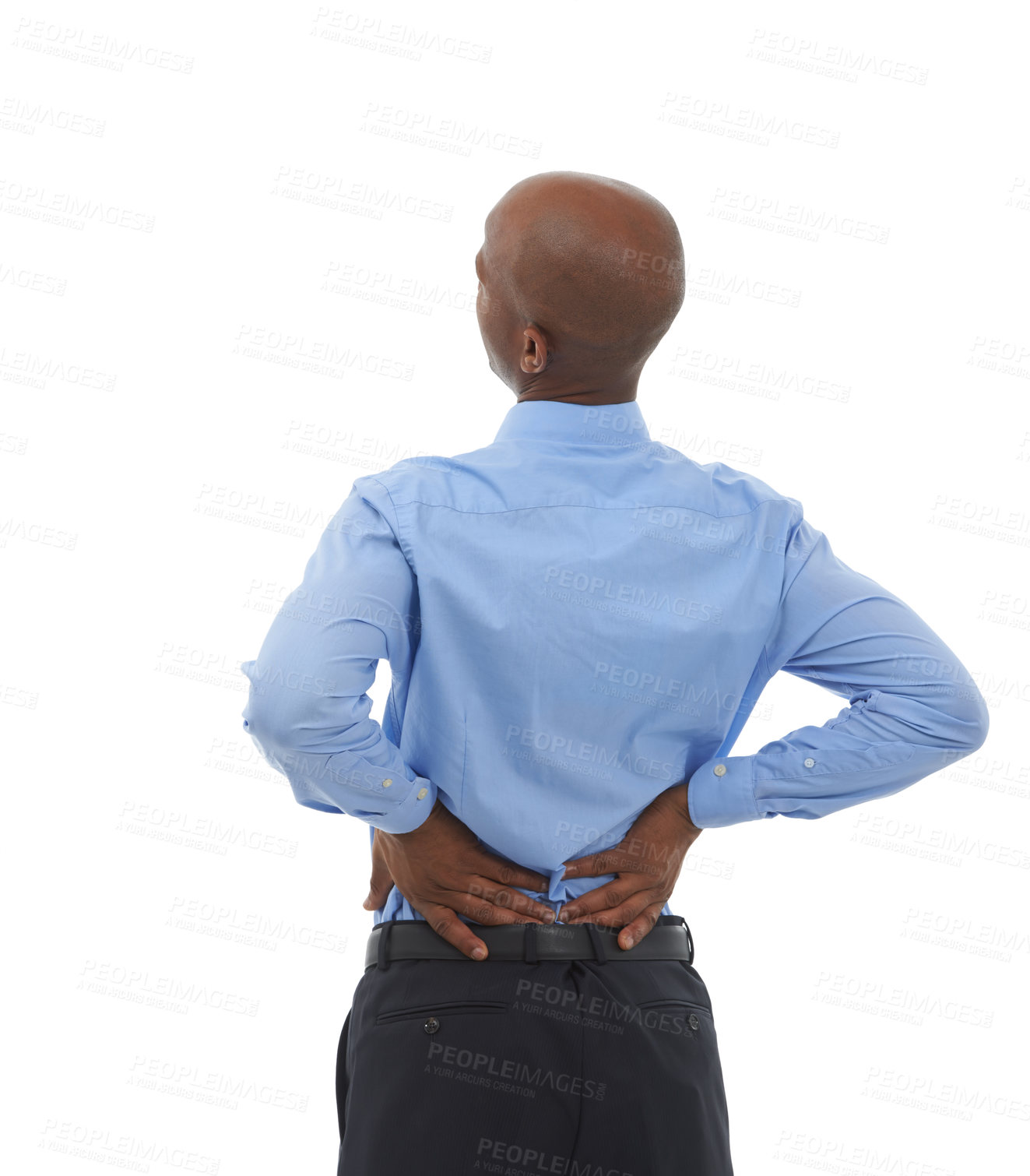 Buy stock photo Rearview studio shot of an african american businessman holding his lower back in pain