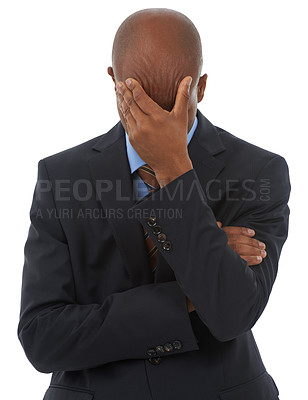 Buy stock photo An African-American businessman standing with his head in his hands
