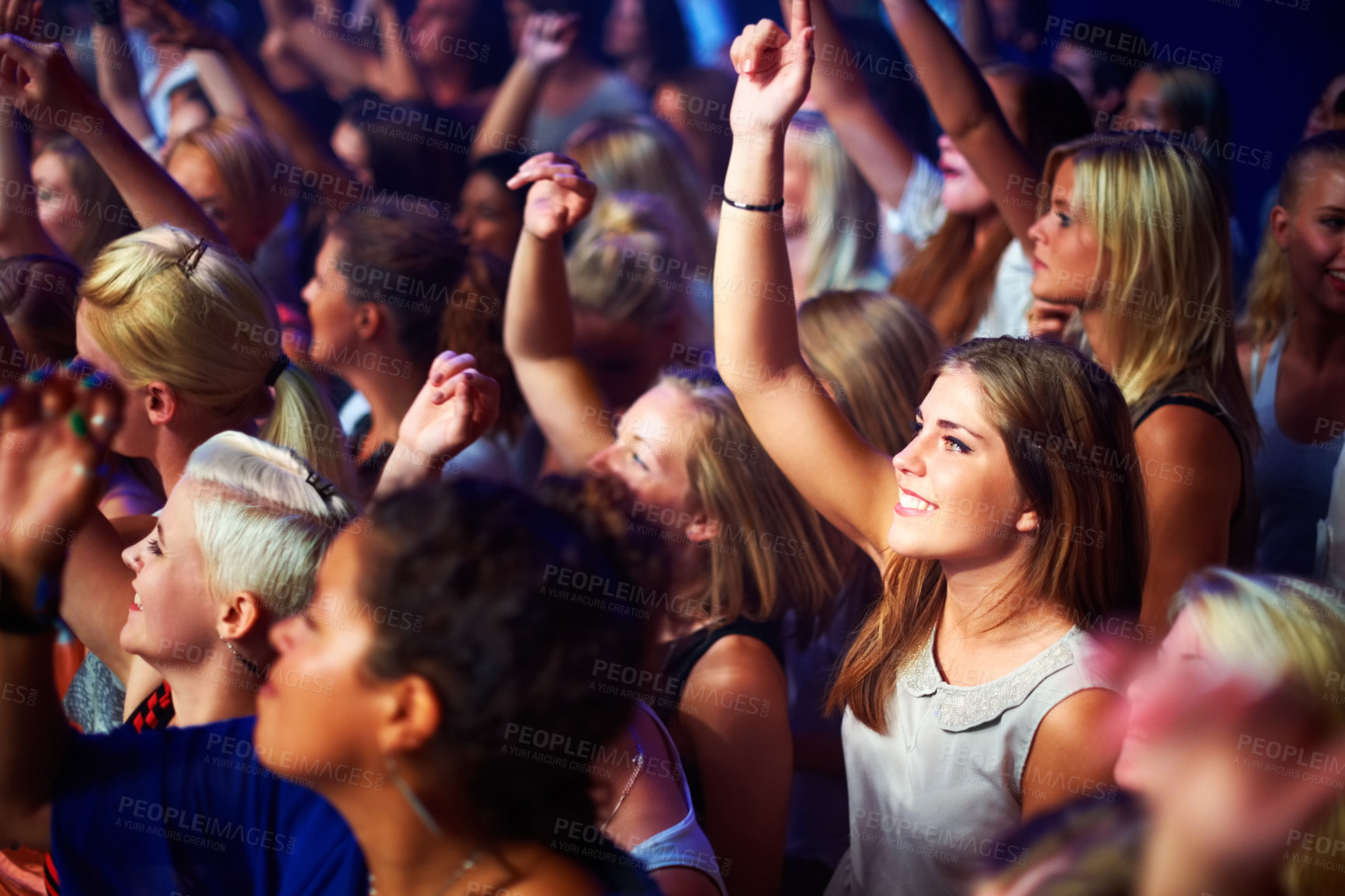 Buy stock photo A group of adoring fans singing along to their favorite song. This concert was created for the sole purpose of this photo shoot, featuring 300 models and 3 live bands. All people in this shoot are model released.