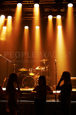 Buy stock photo Silhouette, band and playing at stage for concert, spotlight and instruments for music festival. Musician, singing and sound entertainment by event equipment by technology and audio performance