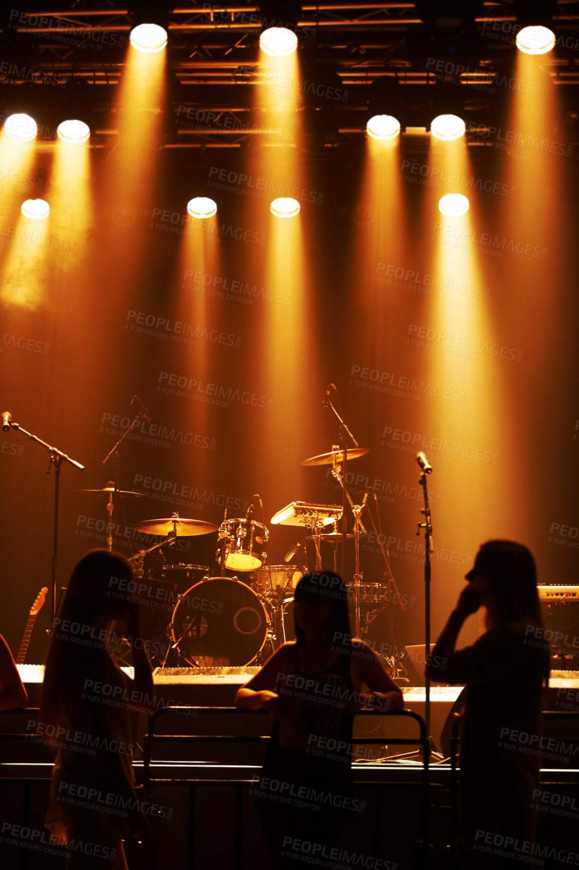 Buy stock photo Silhouette, band and playing at stage for concert, spotlight and instruments for music festival. Musician, singing and sound entertainment by event equipment by technology and audio performance