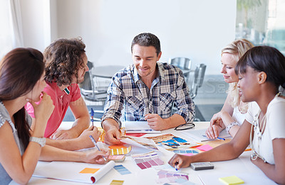 Buy stock photo A group of interior designers deciding on colours in their studio