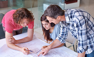 Buy stock photo Planning, group and architect on blueprint in office on creative project at startup table. Serious designer, teamwork or engineer on drawing, document and people brainstorming sketch for construction