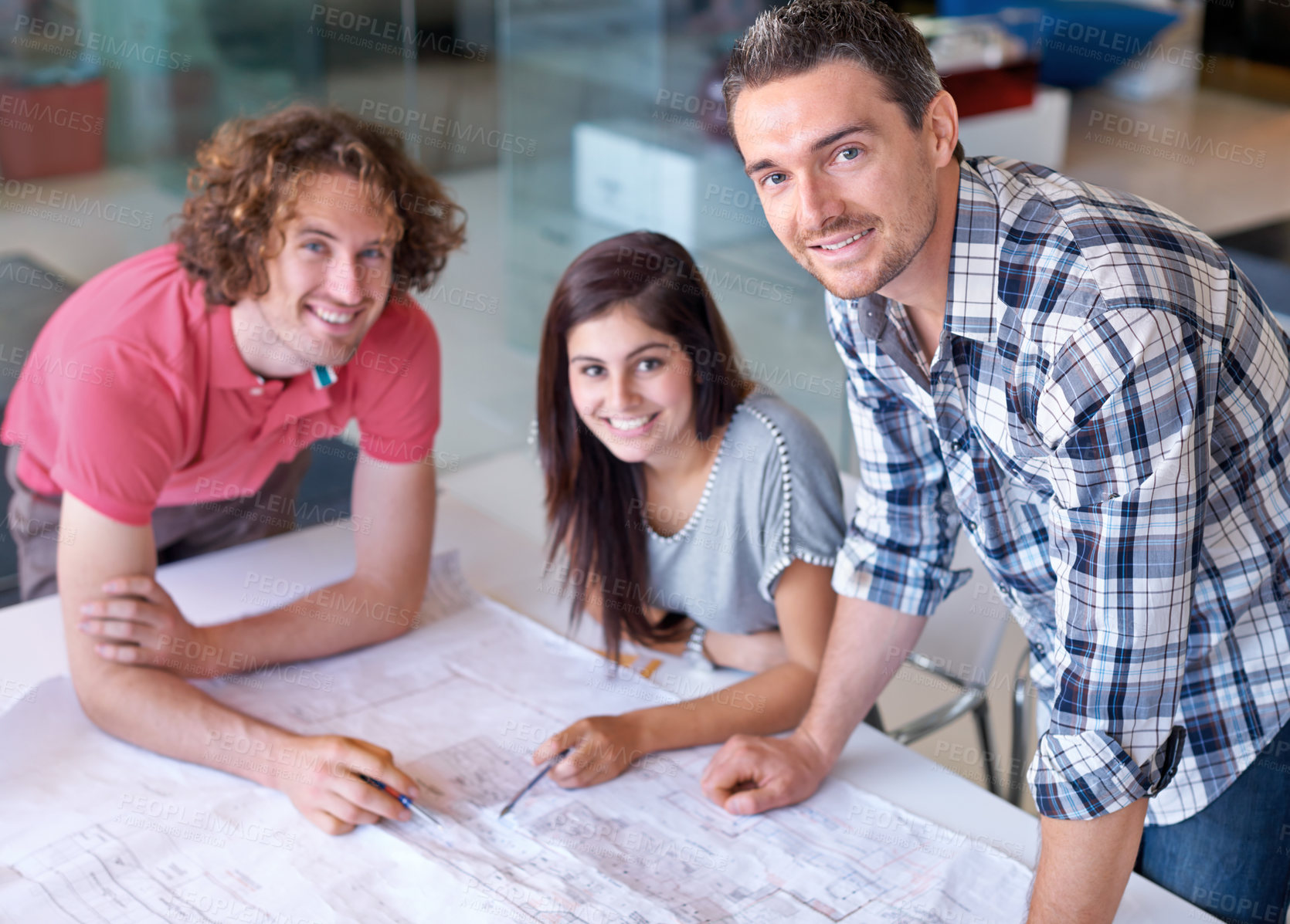 Buy stock photo Portrait, happy team and architect on blueprint in office on creative project at startup table. Face, smile and designer group, engineer or professional people drawing paper for construction together
