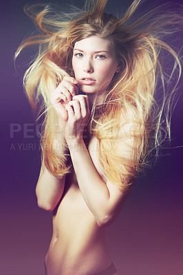Buy stock photo Studio portrait of a topless young woman with her windswept hair covering her body