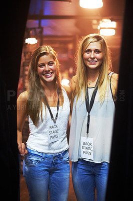 Buy stock photo Two young women with backstage passes at a concert. This concert was created for the sole purpose of this photo shoot, featuring 300 models and 3 live bands. All people in this shoot are model released.