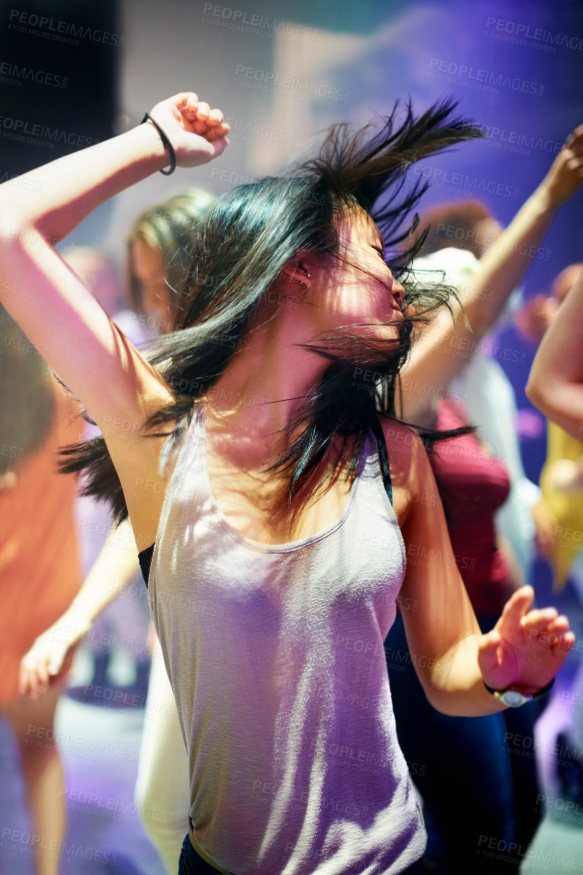Buy stock photo Shot of an attractive woman dancing to the music. This concert was created for the sole purpose of this photo shoot, featuring 300 models and 3 live bands. All people in this shoot are model released.