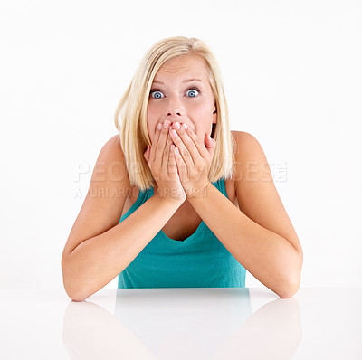Buy stock photo Woman, gossip and cover mouth in portrait with surprise, secret and announcement in studio on white background. Wow, shocked and girl with hands on face for crazy fake news, drama or story of mistake