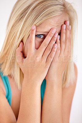 Buy stock photo Scared, portrait and woman with hands on face, fear and confused with trauma in horror studio. Panic, scary danger and shocked embarrassed girl with stress, anxiety and terror on white background.