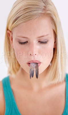 Buy stock photo Woman, face and eating tail of fish with surprise on white background, studio or mockup. Crazy, diet and person with doubt in weird seafood, cuisine and taste gross tuna or strange food in mouth