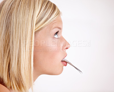 Buy stock photo Profile of woman with fish in mouth in studio with shock, healthy food and omega 3 supplements. Surprise, taste and girl eating whole sardine, benefits of oil in diet and vitamin on white background