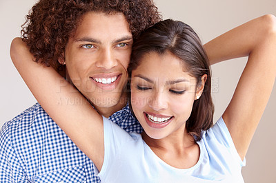 Buy stock photo Couple, romance and hugging in studio, love and bonding in relationship on brown background. Happy people, loyalty and support in embrace, security and trust in marriage commitment or partnership