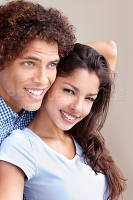 Buy stock photo Couple, commitment and hugging in studio, love and bonding in relationship on brown background. Happy people, loyalty and support in embrace, security and trust in marriage or care in partnership