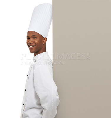 Buy stock photo Portrait, happy man and chef on billboard menu in studio isolated on a white background mockup space. Smile, cooking and African person on poster for advertising, marketing and show promotion banner