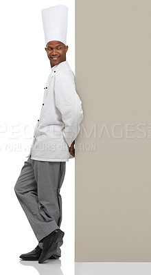 Buy stock photo Happy man, chef and poster menu in studio isolated on a white background mockup space. Smile, cooking and African person on billboard for advertising, marketing sign and restaurant promotion banner